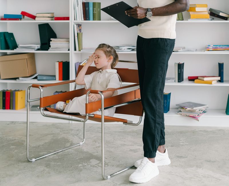 Child receiving speech therapy in a clinical setting