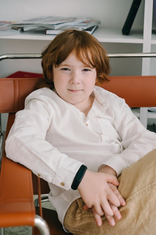 Portrait of a Boy with Red Hair Wearing a White Shirt