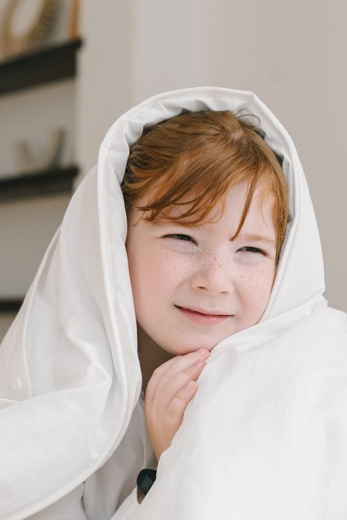 Free Photo of a Boy with a White Blanket on His Head Stock Photo
