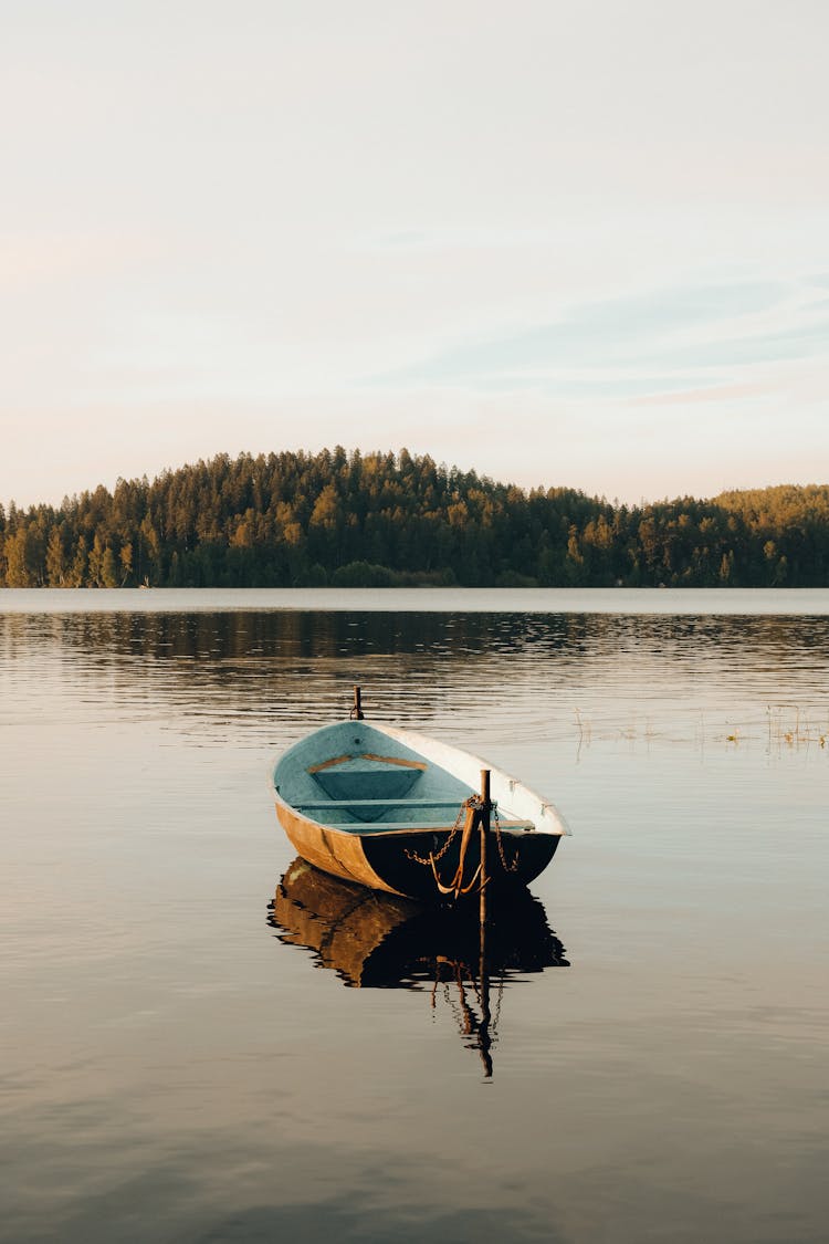 A Wooden Boat On A Lake