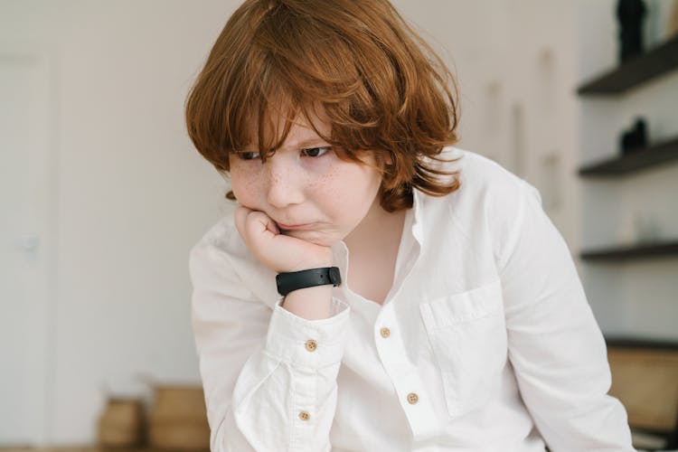 Boy With Hand Under Chin