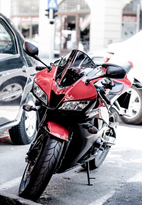 Red Big Bike Parked Near Cars