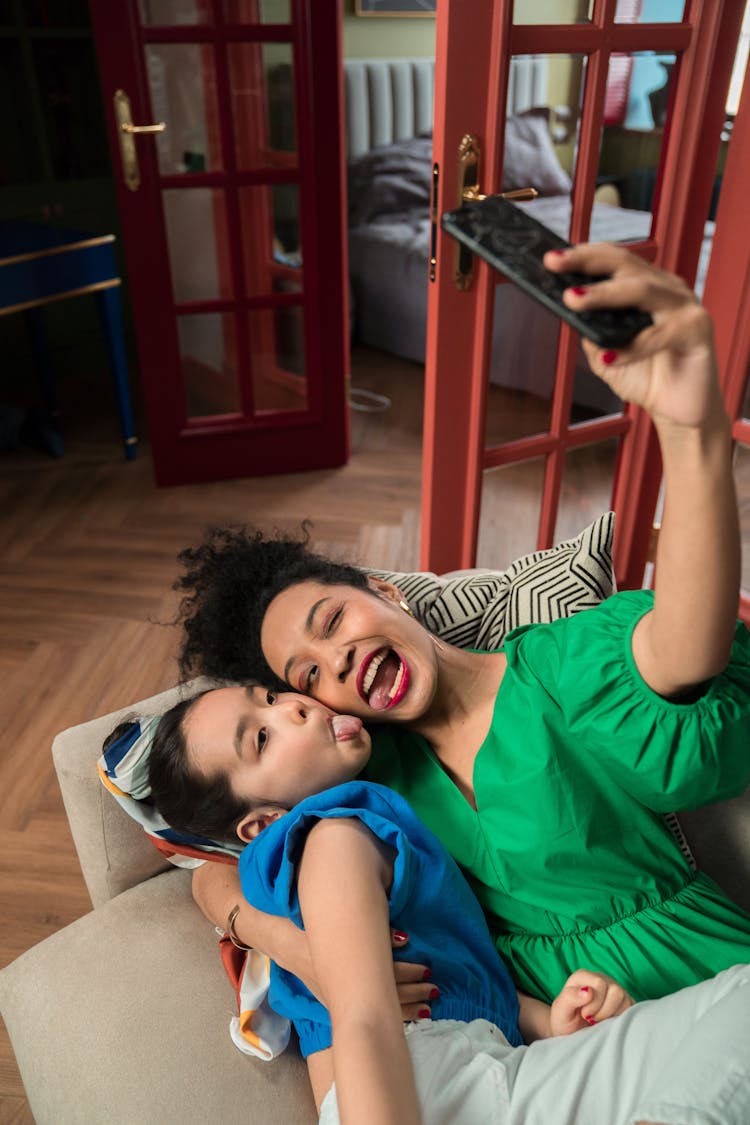 Mother And Daughter Taking A Selfie 