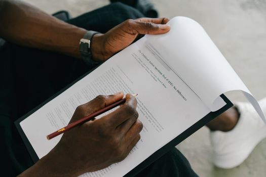 Person Writing on White Paper