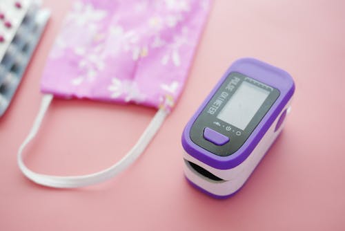 Close-Up Shot of a Purple Pulse Oximeter