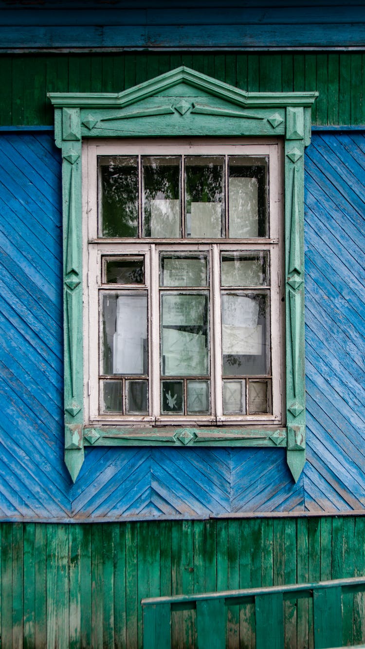 Window Of A Blue And Green Wooden House