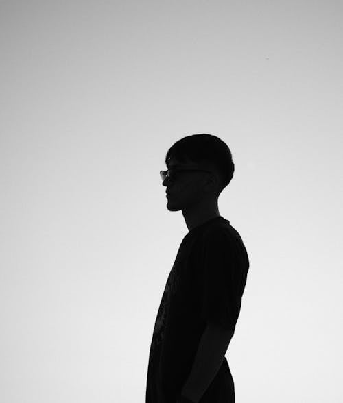 Free A Silhouette of a Man Standing Stock Photo