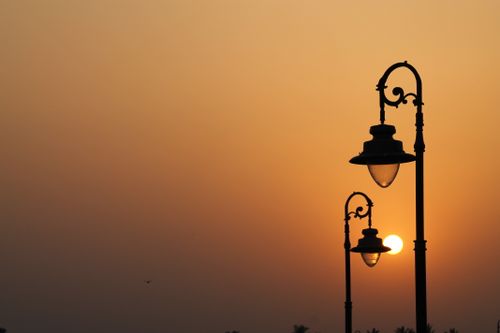 Free Silhouette of antique street lamps with a vibrant sunset in Kolkata, India. Stock Photo