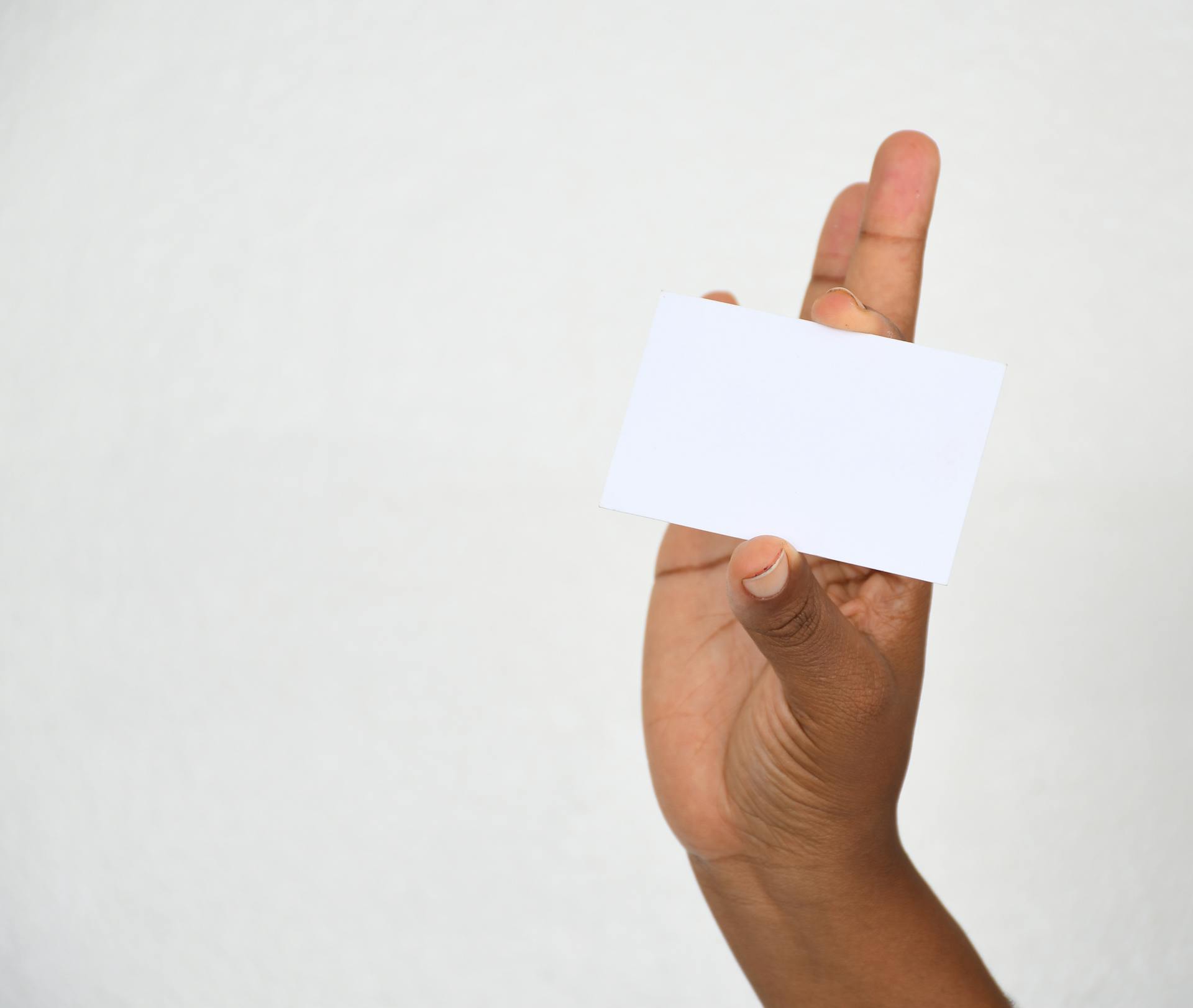 Person Holding a White Card