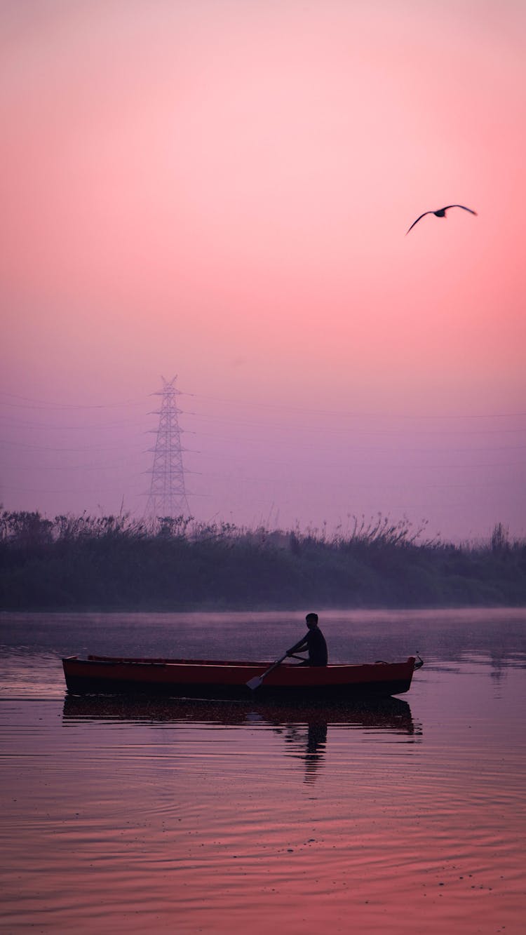 Man Riding On A Boat