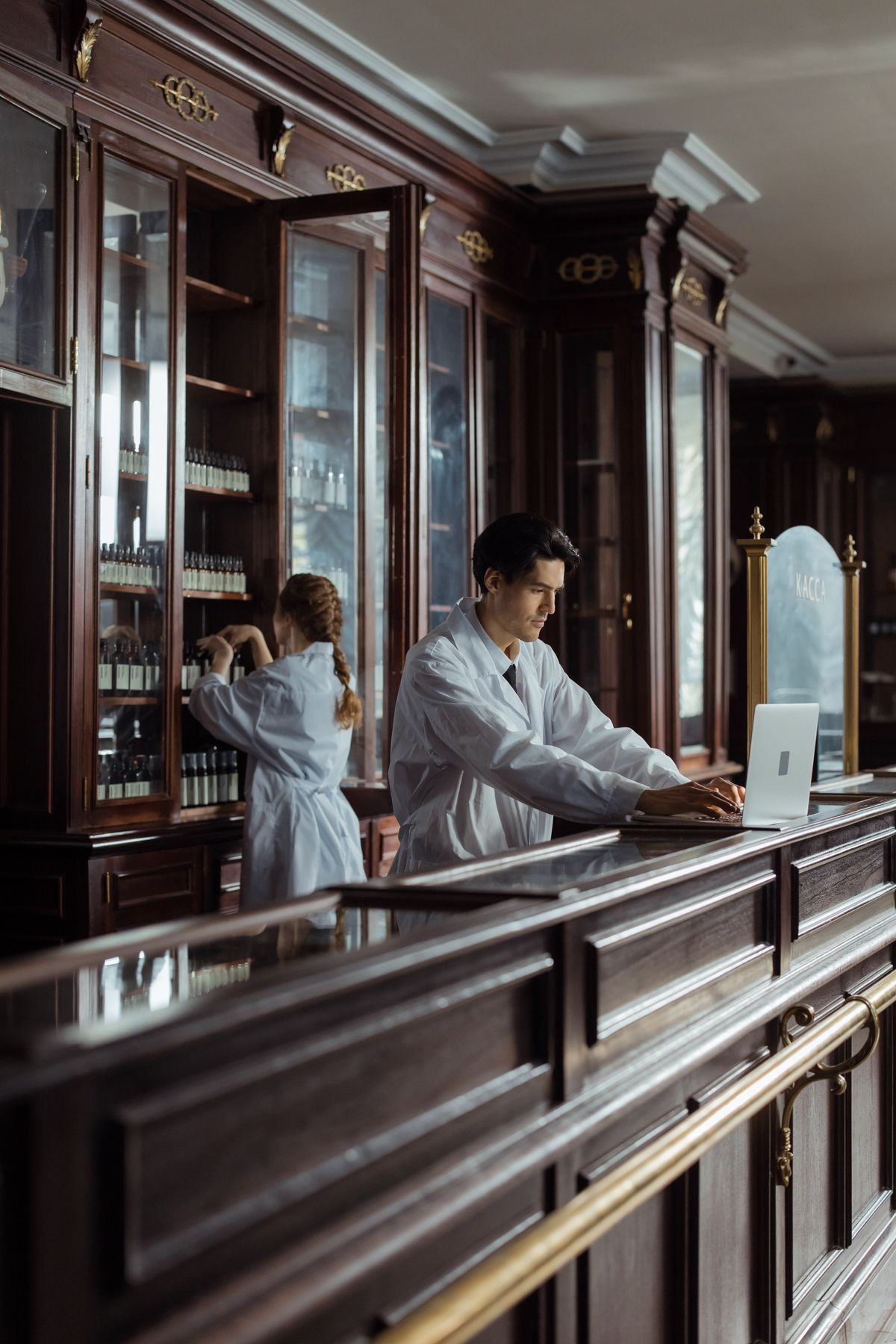 Pharmacists in a traditional pharmacy setting