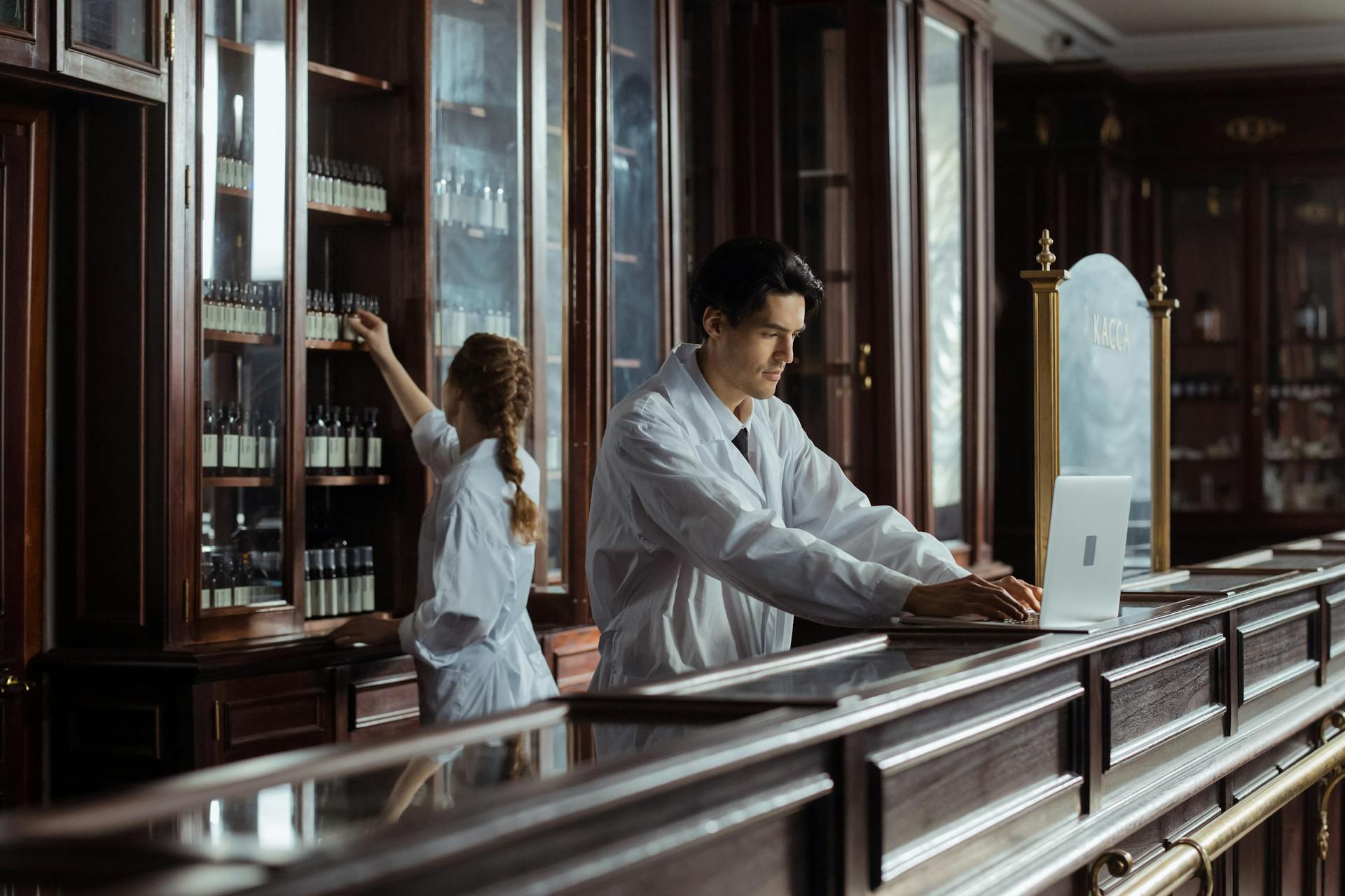 Man and Woman Working in Retro Pharmacy