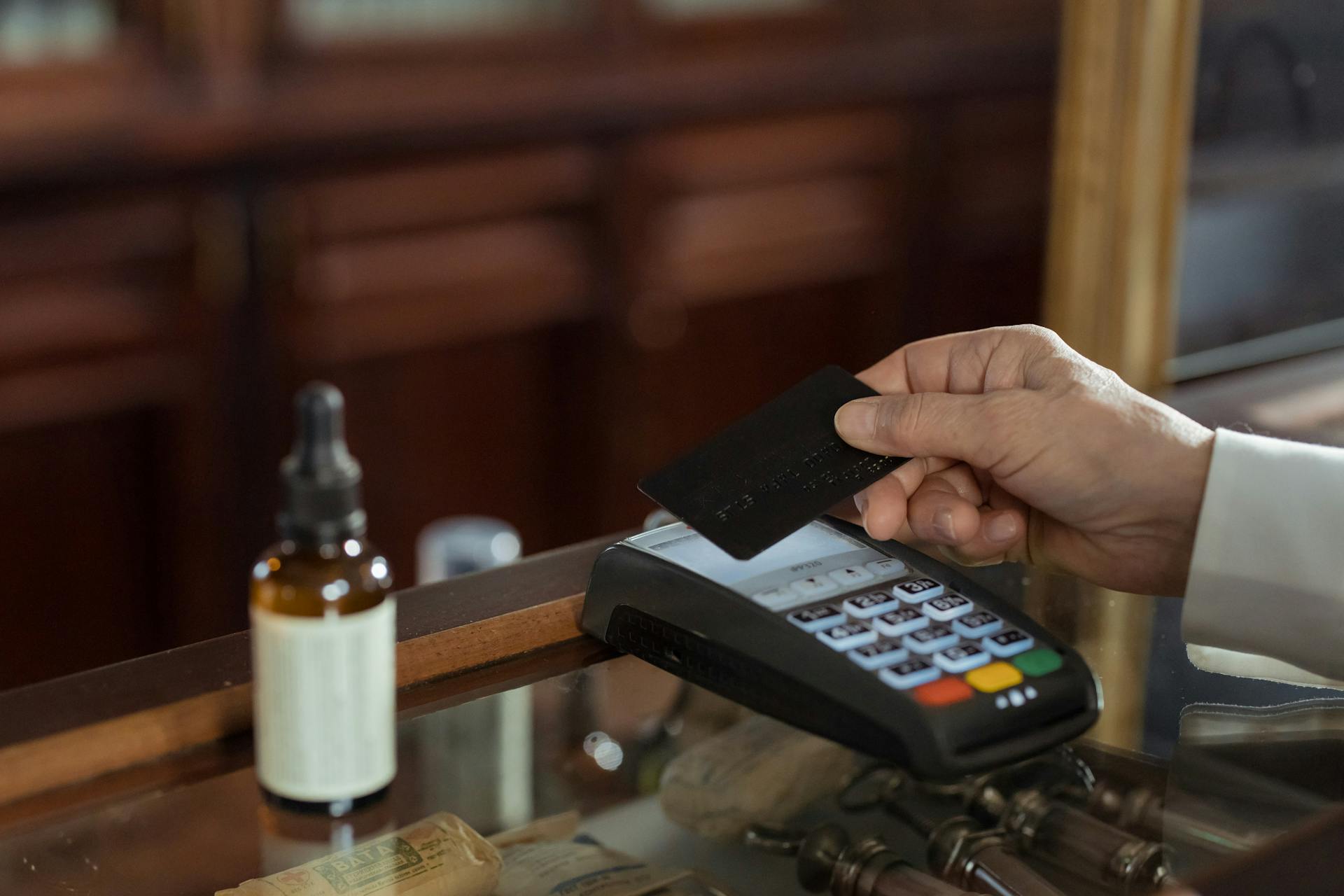 Person Holding a Black Card