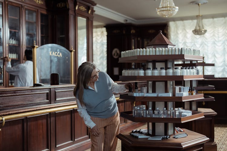 Customer By Medications Display At Pharmacy