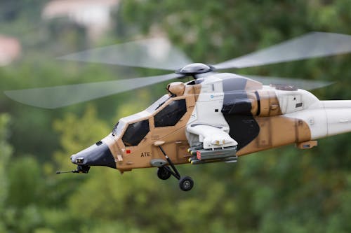 Free Photo of a White and Brown Radio-Controlled Helicopter Stock Photo