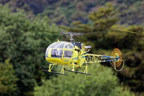 Free Photo of a Yellow and Blue Radio-Controlled Helicopter Stock Photo