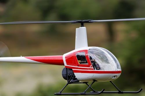 Free Photo of a White and Red Radio-Controlled Helicopter Stock Photo