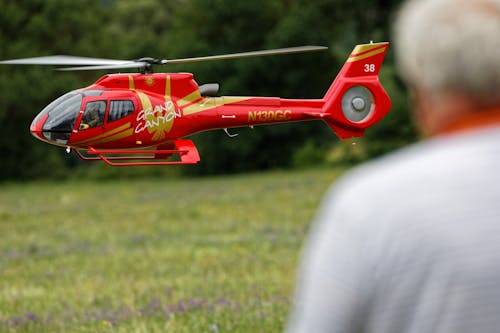 Free A Radio-Controlled Helicopter Near a Person Stock Photo