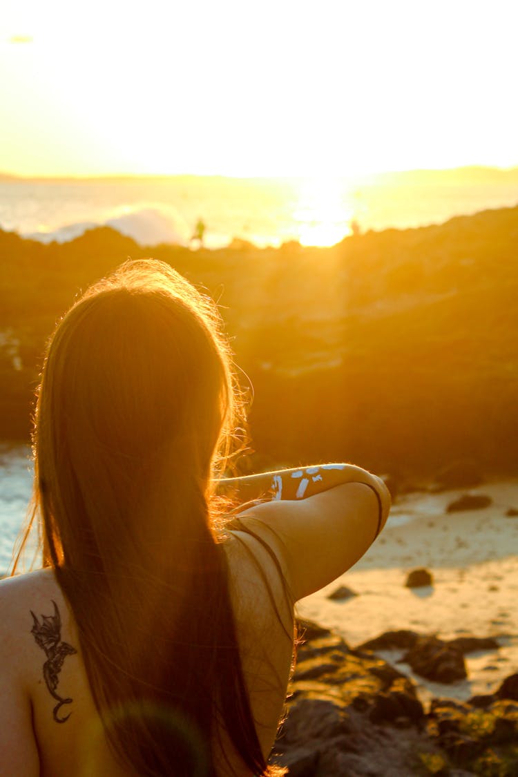 A Woman Watching The Sunset