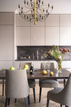 Sophisticated dining area featuring a wooden table, chic chairs, and stylish decor.