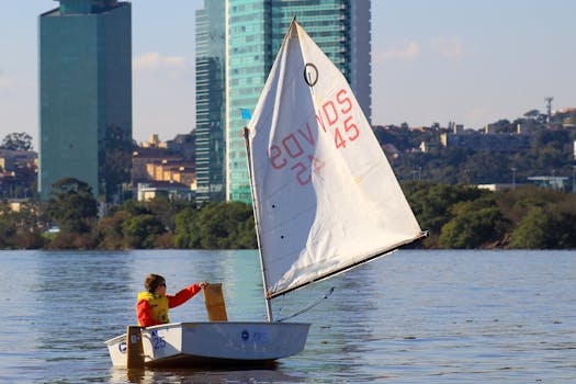 Photo of a Boy Sailing on the Sea