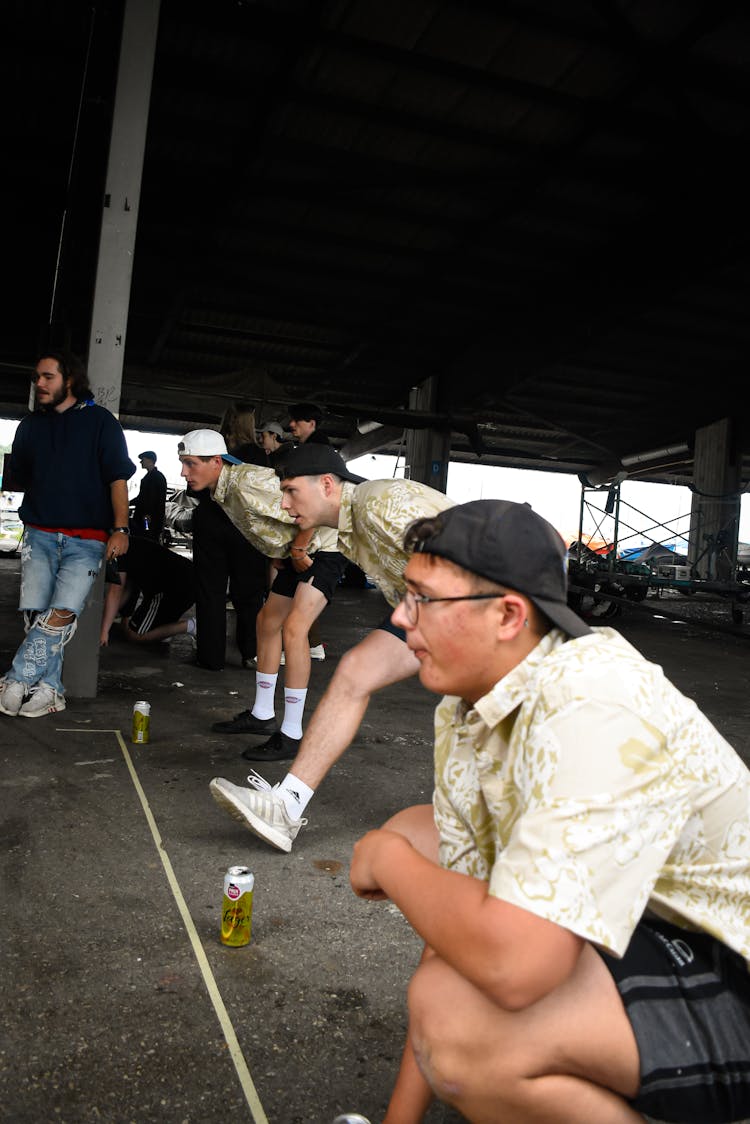 Group Of Men Having Party In Old Warehouse