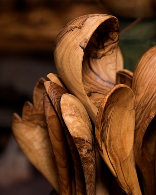 Free A detailed close-up of rustic wooden spoons showcasing their natural grain pattern and craftsmanship. Stock Photo
