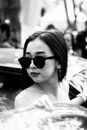 Woman Wearing Black Sunglasses in Grayscale Photography