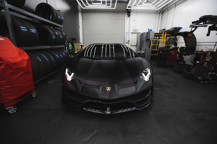 Black Sports Car Parked  Inside A Garage