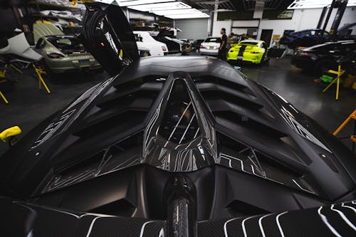 Free Black Roof of a Lamborghini with Carbon Fiber Spoiler Stock Photo