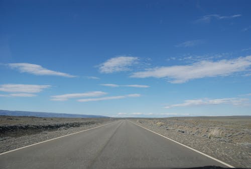 Free stock photo of blue sky, desolate, desolate road Stock Photo