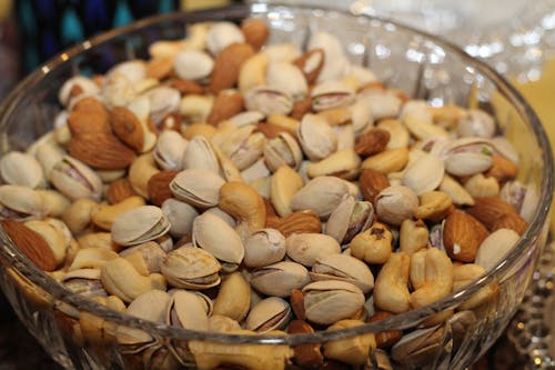 Free White Yellow and Brown Peanut on Clear Glass Basin Stock Photo