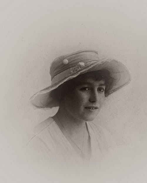 Woman Wearing A Hat In Grayscale Photography