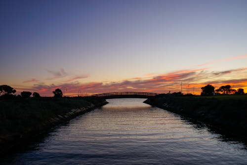 Free Silhouette of a Bridge During Sunset Stock Photo