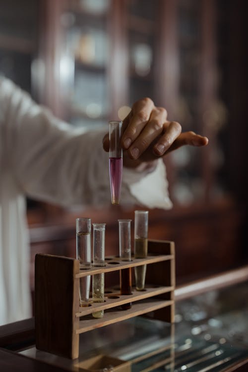 A Person Holding a Test Tube