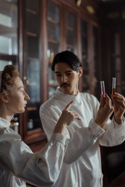 A Man Holding Test Tubes