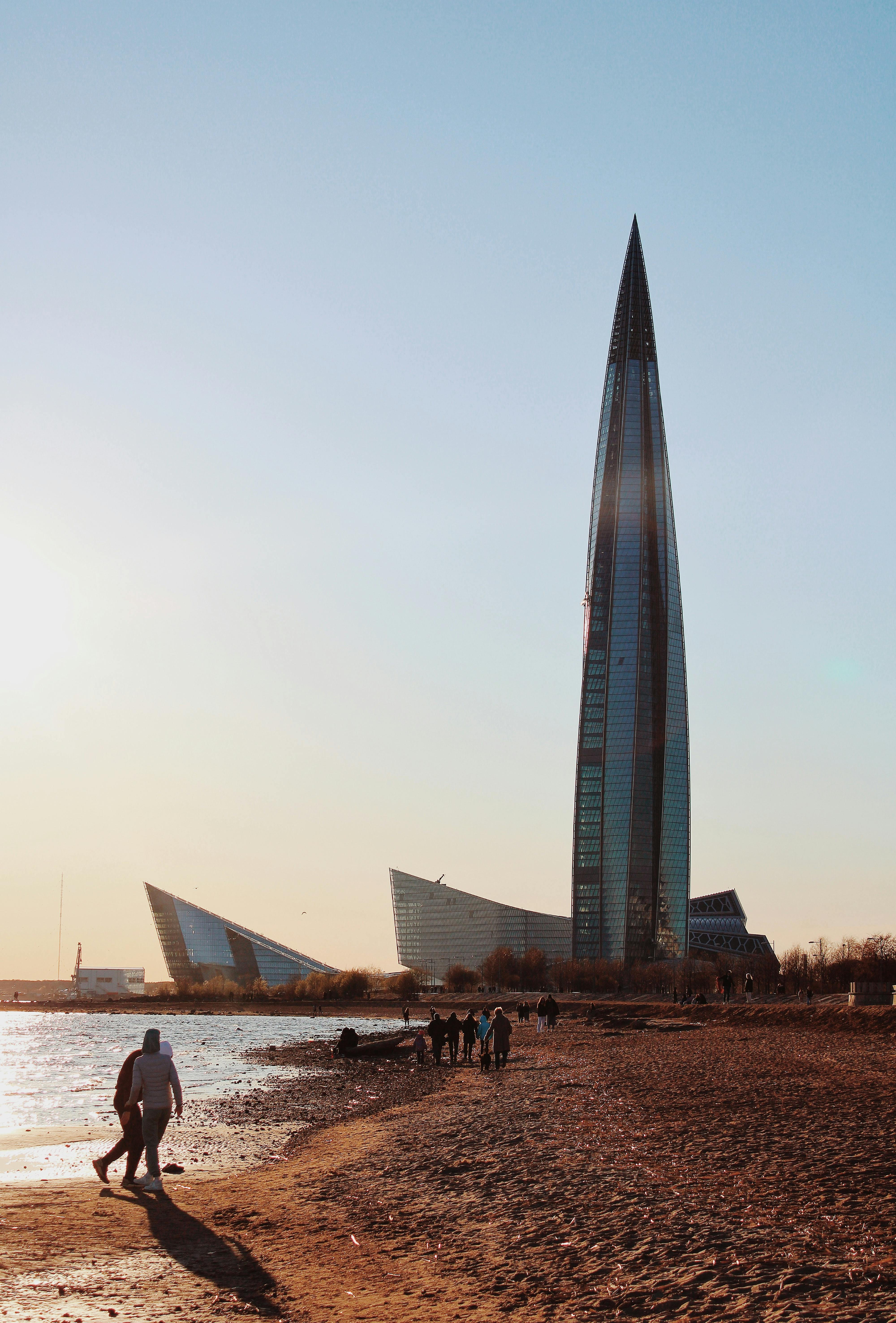 A stunning view of the Lakhta Center skyscraper at sunset by the beach in Saint Petersburg, Russia.