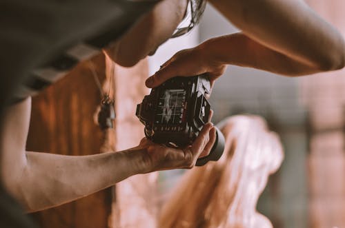 Person Taking Photo of a Woman