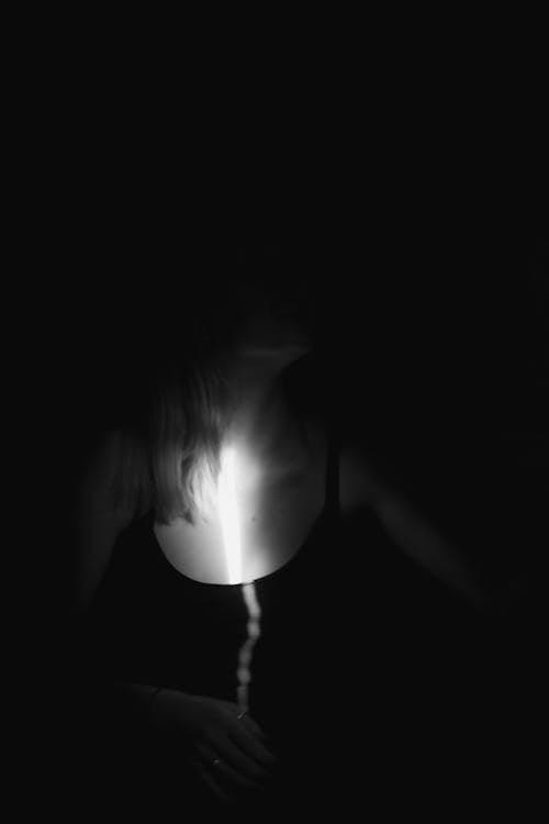 Free Grayscale Photo of Sunlight on a Woman's Chest Stock Photo