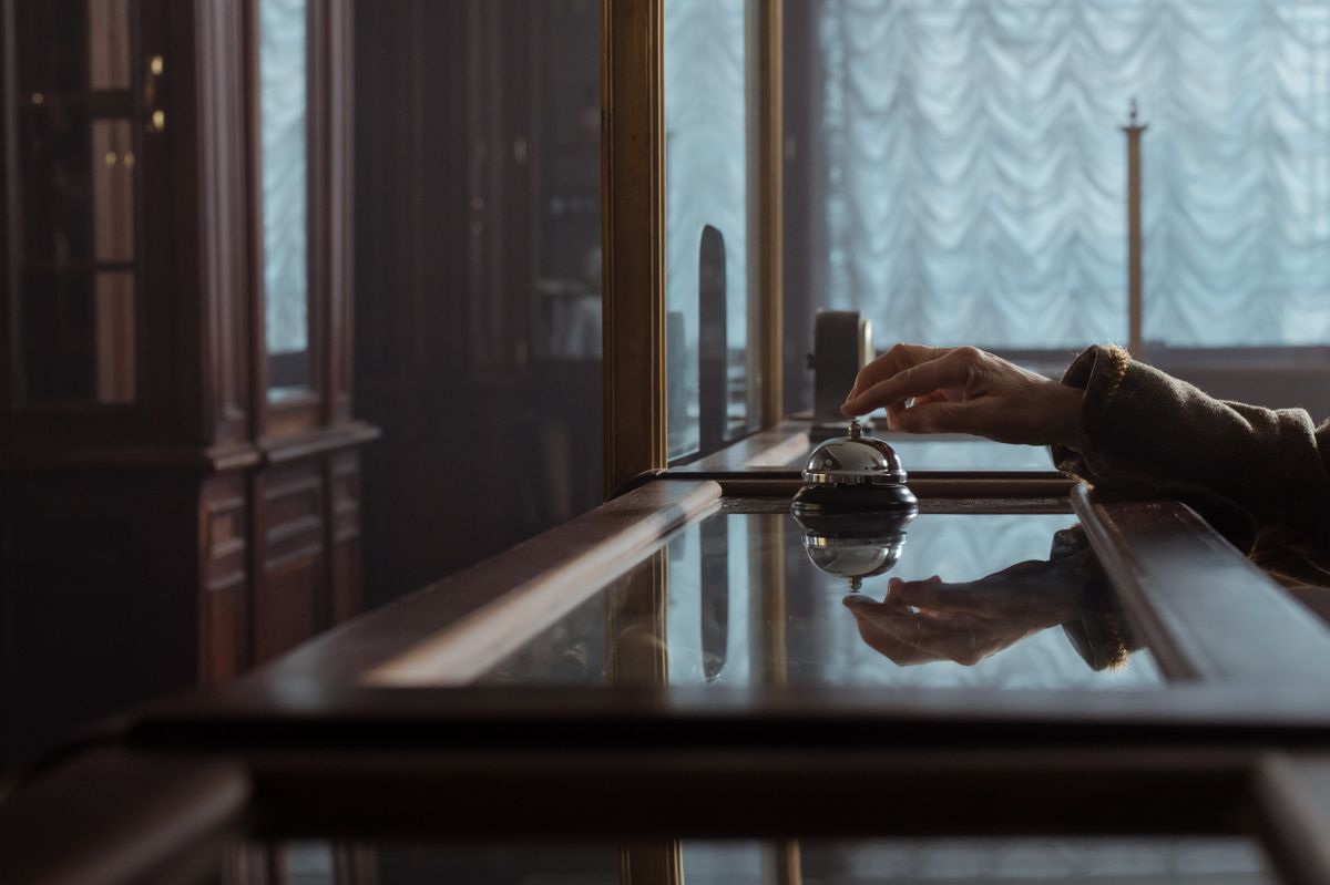 The reception desk in dark wood