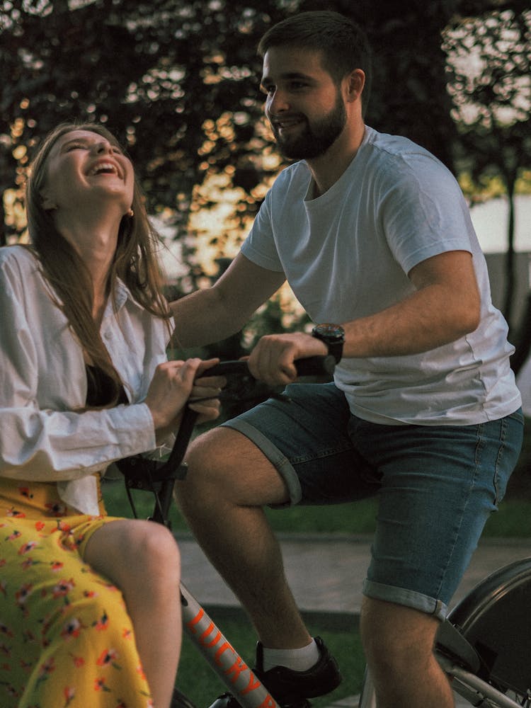 Beautiful Couple Riding A Bike