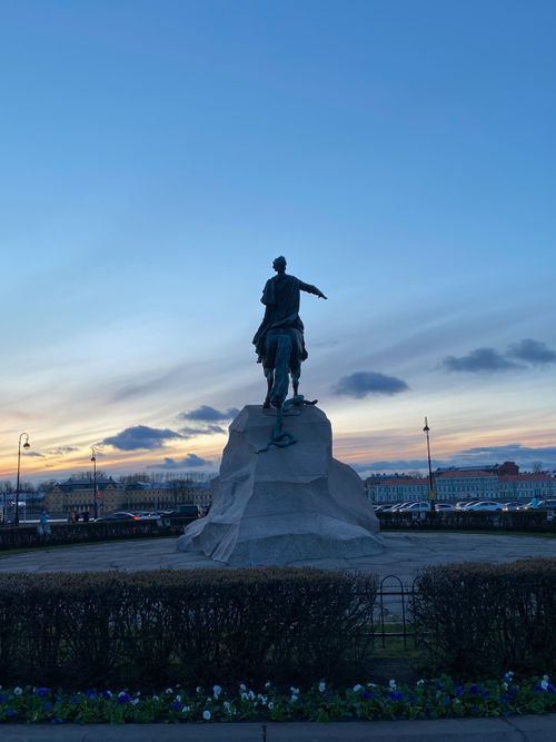 Free The Bronze Horseman statue silhouetted against a serene sunset in Saint Petersburg, Russia. Stock Photo