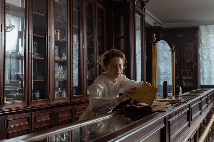 A Female Pharmacist On The Counter