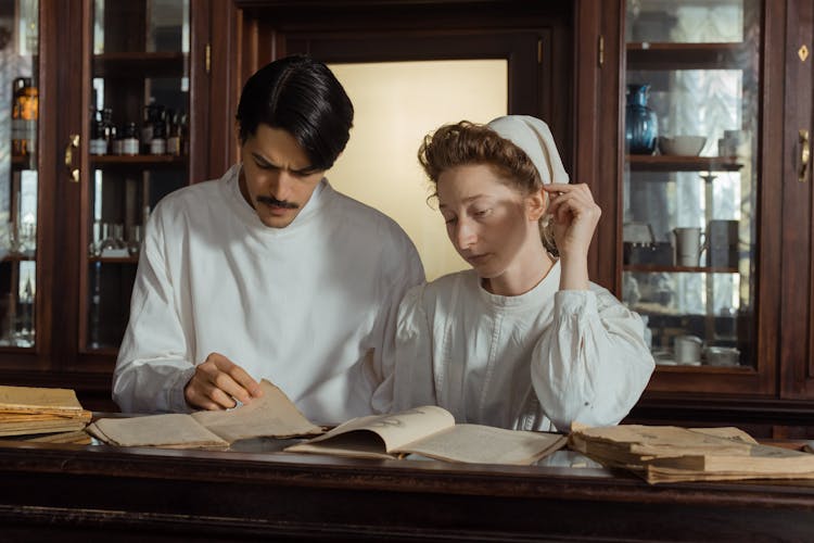 Pharmacists Studying On Books 