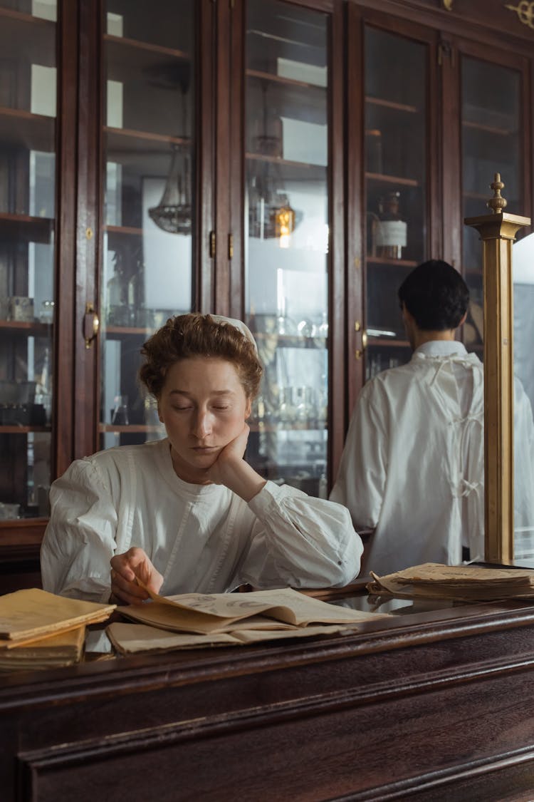 Female Pharmacist Reading Books 