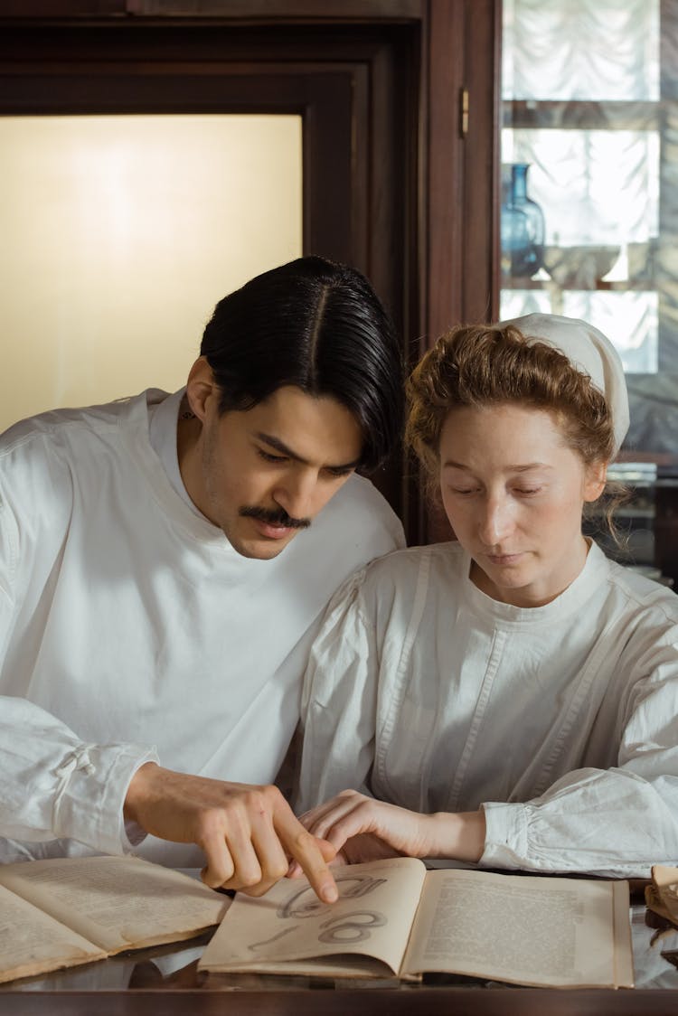 Two Pharmacists Reading A Book