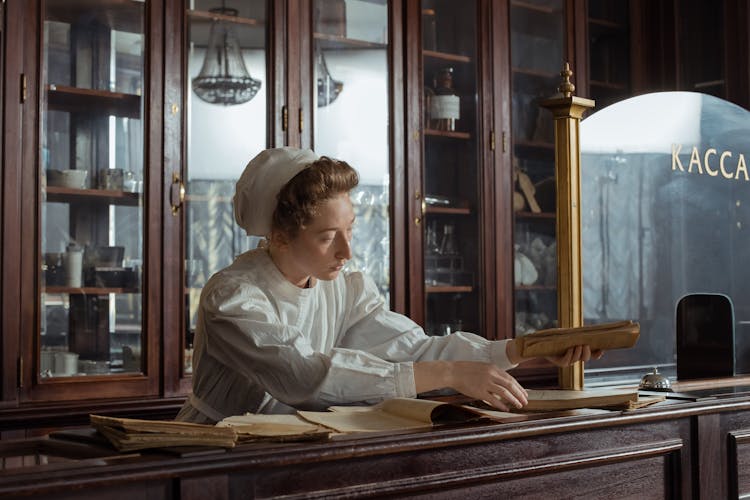 A Female Pharmacist On The Counter