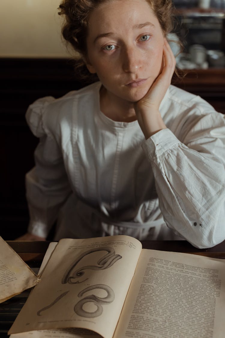 A Female Pharmacist In White Top