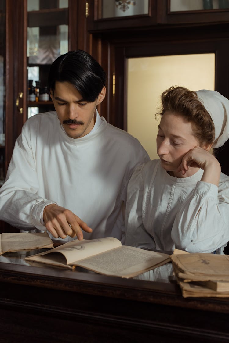 Two Pharmacists Reading A Book