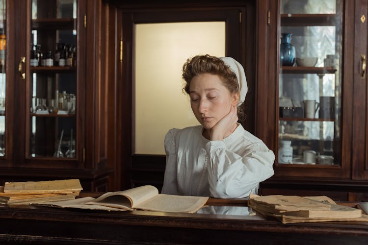 Female Pharmacist Reading Books 